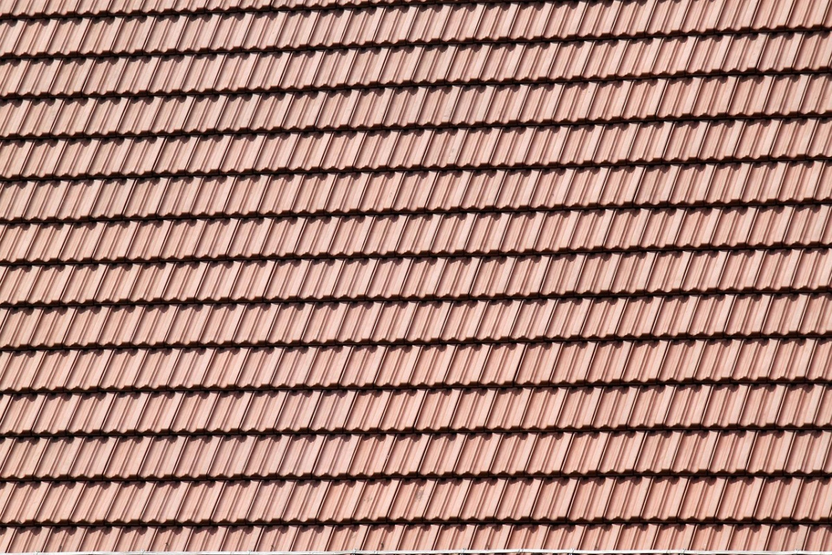 roof workers installing shingles