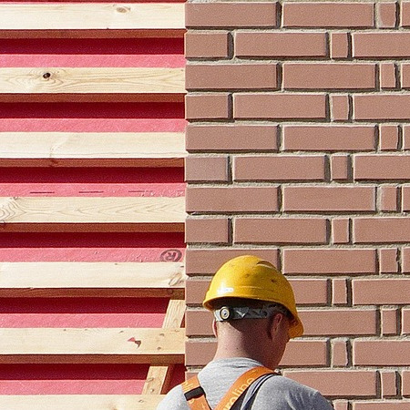 project manager on roof in hard hat